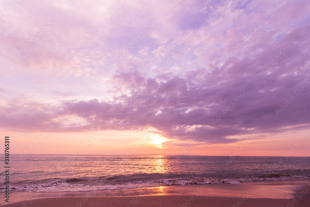 Fototapeta premium Dyeing the image into purple tones. Beautiful sunset at seascape. Beach area in front of Ban Ta Nuak School Khlong Yai Subdistrict, Khlong Yai District, Hong Kong, Trat, Thailand 23110