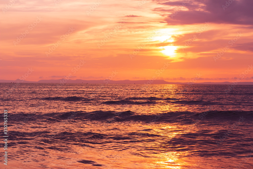 Fototapeta premium Beautiful sunset at seascape. Beach area in front of Ban Ta Nuak School Khlong Yai Subdistrict, Khlong Yai District, Hong Kong, Trat, Thailand 23110