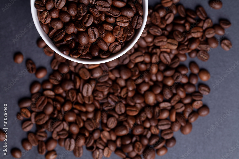 Roasted coffee beans on granite background