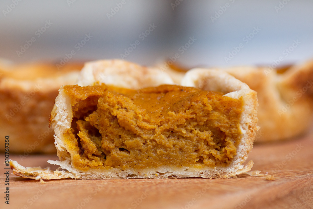 Mini pumpkin pie tart cut in half