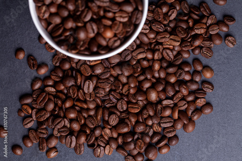 Roasted coffee beans on granite background