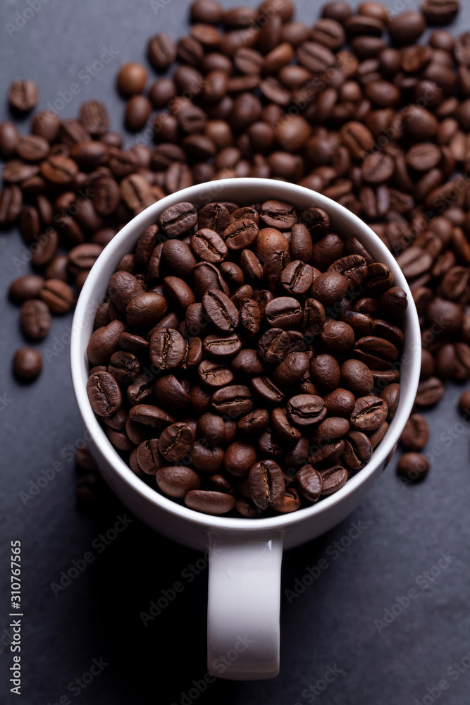 Fototapeta premium Roasted coffee beans on granite background