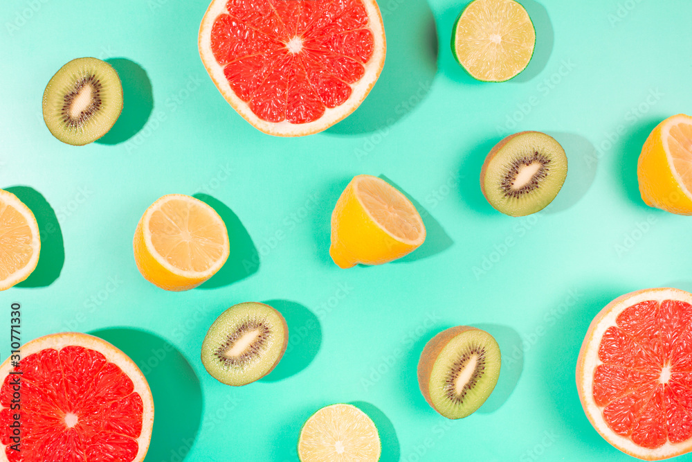 Fruits on trendy green background. Flat lay style. Fruits on trendy green background. Flat lay style.