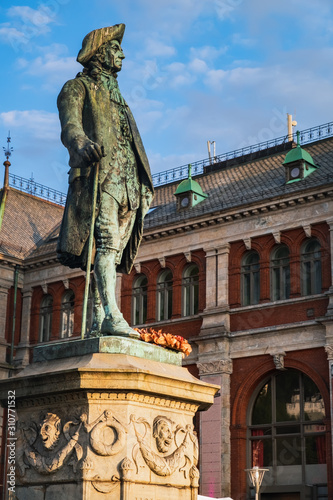 Sunset view of Ludvig Holberg Statue in Bergen, Norway.