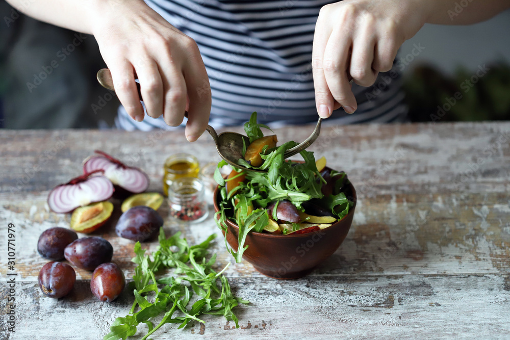 Healthy arugula plum salad. Selective focus. Macro. Healthy arugula plum salad. Selective focus. Macro.