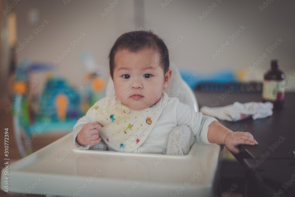 Asian baby sitting high chair Asian baby sitting high chair
