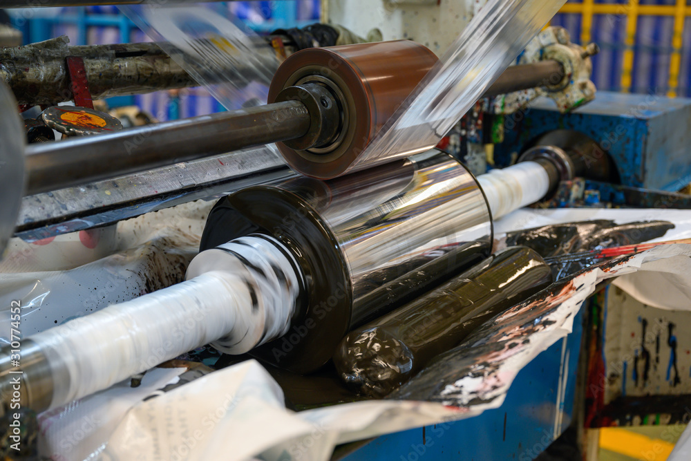 Gravure plastic bag printing machines are working at a high speed to print images with color in the factory.