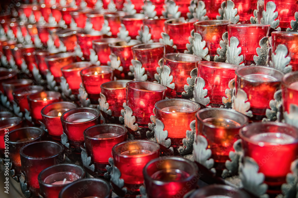 Closeup shot of many candles of the famous Chapel of the Holy Cross
