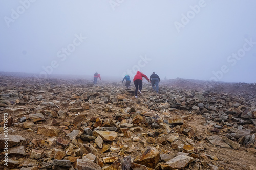 HIking in whiteout snowy windy conditions photo