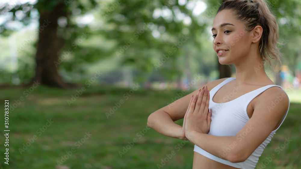 caucasian pretty woman having yoga in park caucasian pretty woman having yoga in park