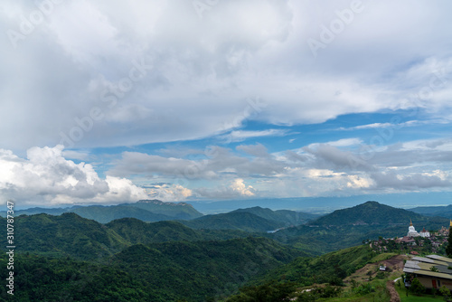 beautiful blue sky high peak mountains mist fog wildlife green forest at Khao Koh, Phu Tub Berk, Phetchabun, Thailand guiding idea long weekend for backpacker camping campfire relaxing hiking