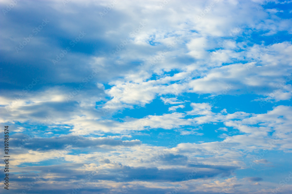 Blue sky and white clouds in day time.