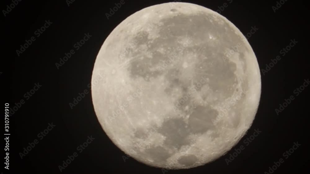 Full moon over dark black sky at night Full moon over dark black sky at night