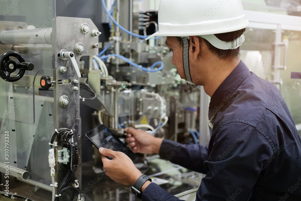 Cropped shot view Manager Technical Industrial Engineer working and control robotics with monitoring system software and industry network connection on tablet. Cropped shot view Manager Technical Industrial Engineer working and control robotics with monitoring system software and industry network connection on tablet.