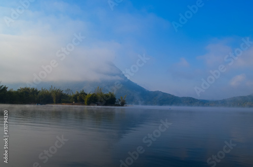 lake and mountain with morning mist