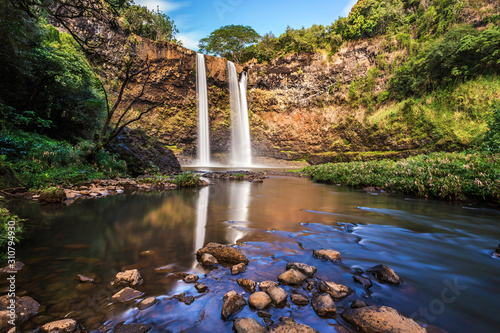 Wailua Falls on the hawaiian island of Kauai. this is a long exposure of the waterfall from the bottom after a short hike photo