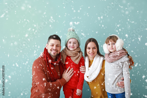 Happy family in winter clot...