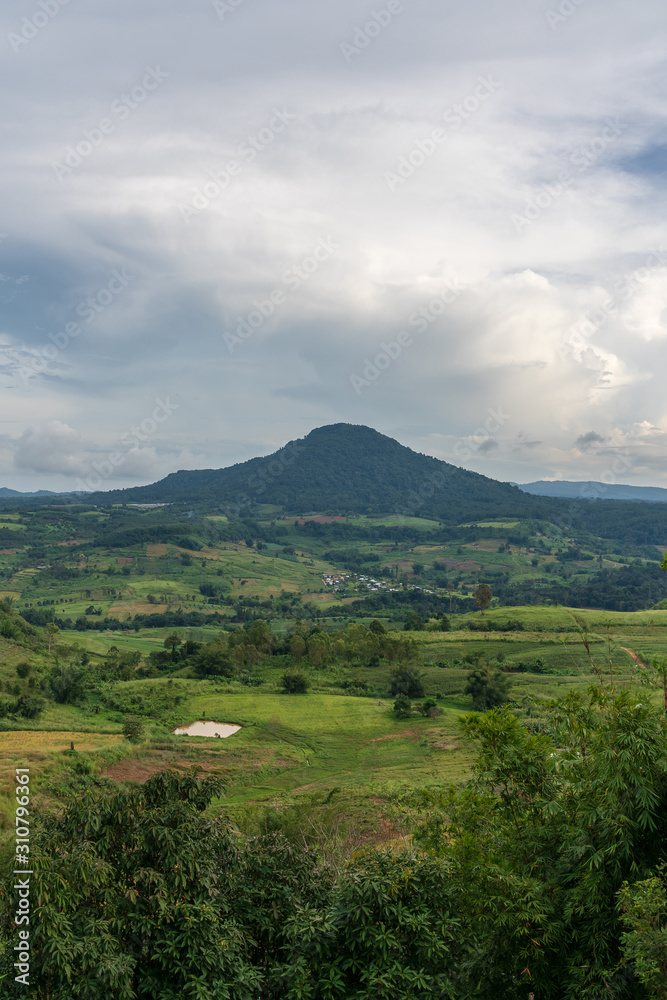 Fototapeta premium beautiful blue sky high peak mountains mist fog wildlife green forest at Khao Koh, Phu Tub Berk, Phetchabun, Thailand guiding idea long weekend for backpacker camping campfire relaxing hiking