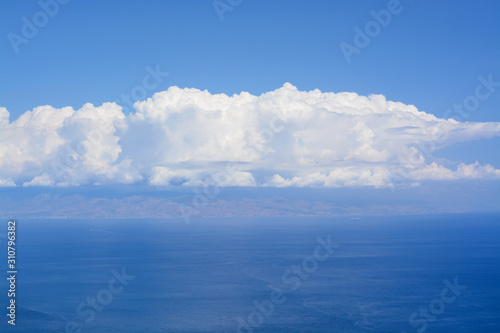 Fototapeta Naklejka Na Ścianę i Meble -  Big white clouds and the sea