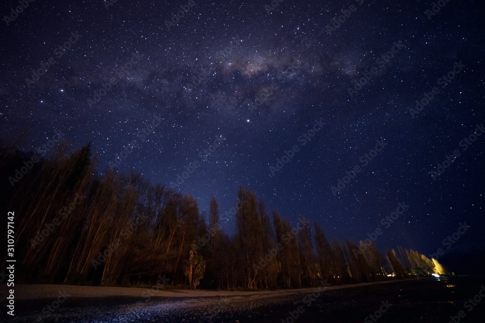 Fototapeta premium Amazing milky way view at Wanaka Lake,New Zealand.Image contain noise and soft focus due to long expose and High ISO