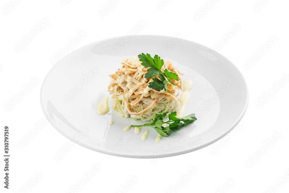White cabbage salad with sliced pancakes on white plate isolated on white background