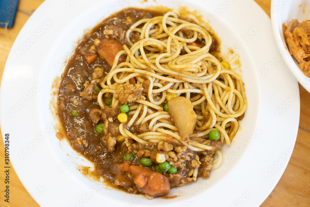 Curry Spaghetti in a White Plate.