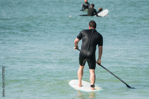 middle aged man on SUP