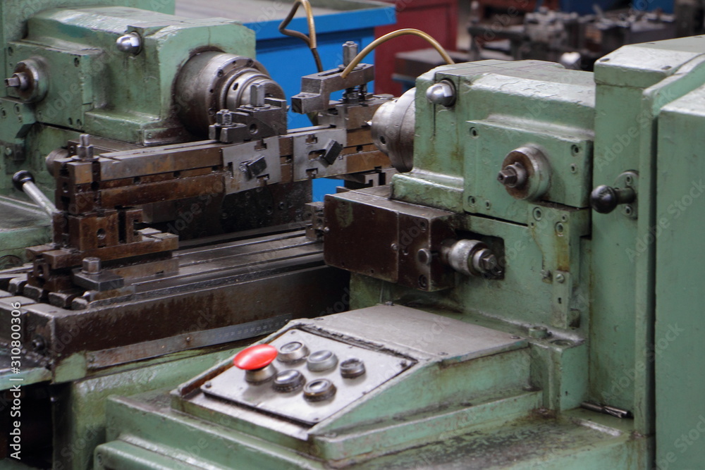 Old metal-removal turning lathe machine tool close up Old metal-removal turning lathe machine tool close up