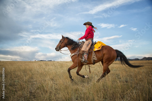 Cowgirl on Running Horse