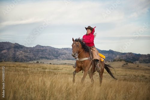 Cowgirl on Running Horse