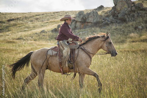 Cowgirl On Buckskin © Terri Cage 