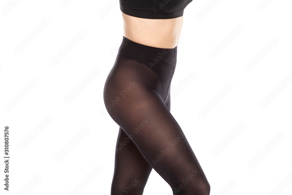© vladimirfloyd - Young woman's legs with nylon tights on white background © vladimirfloyd - Young woman's legs with nylon tights on white background
