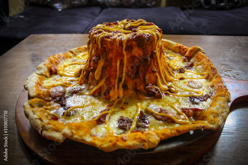 Obraz na plátně A giant pizza menu called Meaty Volcano.