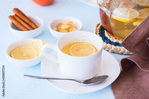 Healthy herbal tea with ginger, lemon and cinnamon.