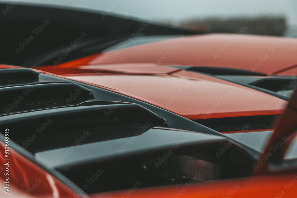 Red super sport's car in detail