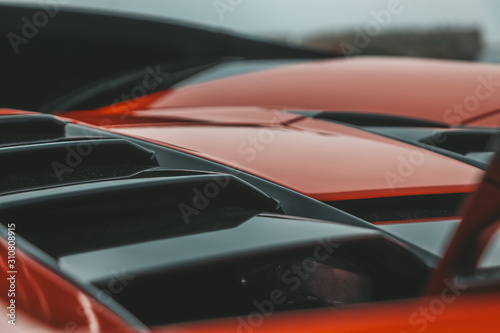 Red super sport s car in detail