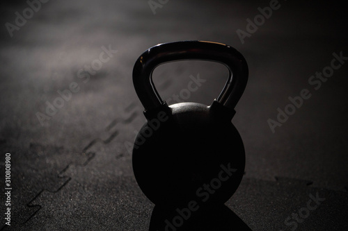 kettlebell on dark flor in gym