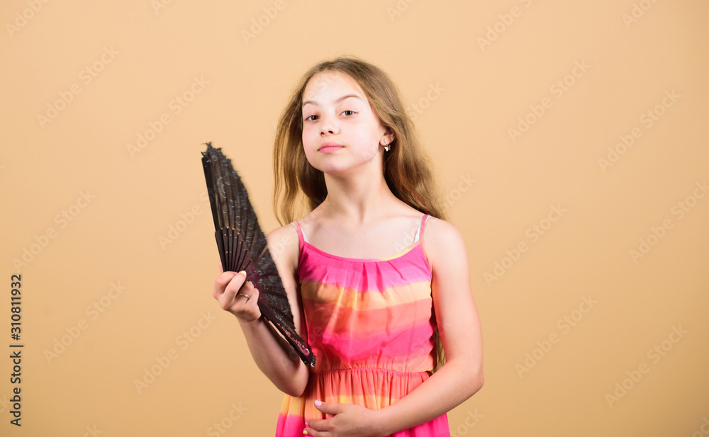 Cooling and ventilation. Conditioning system. Climate control. Air conditioner. Waving to create current air. Little girl waving elegant fan. Summer heat. Fresh air. Kid girl fanning herself with fan Cooling and ventilation. Conditioning system. Climate control. Air conditioner. Waving to create current air. Little girl waving elegant fan. Summer heat. Fresh air. Kid girl fanning herself with fan