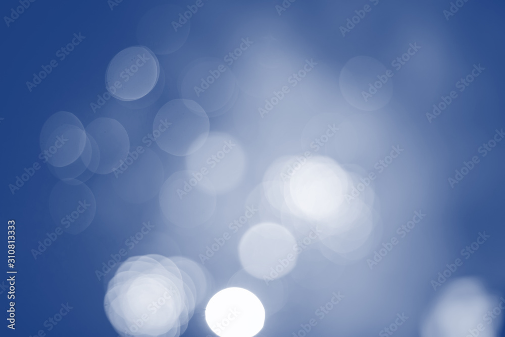 Defocused festive lights in classic blue. Can be used as background Defocused festive lights in classic blue. Can be used as background