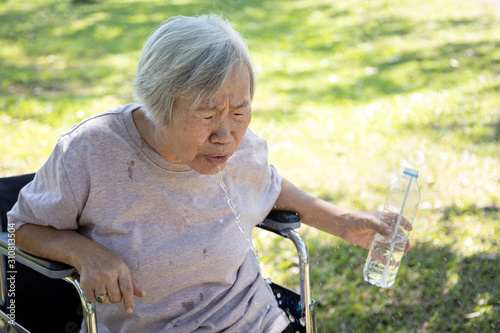 Konstfotografi Asian senior woman choking on water,elderly people with poor quality water,bad s