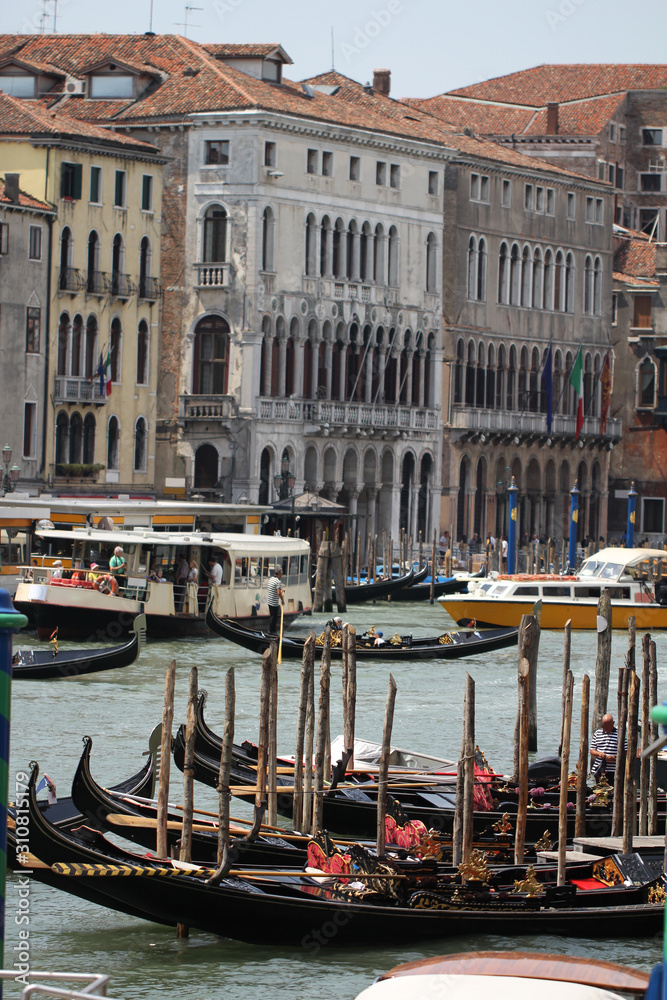 Gondolas on Grand Canal Venice surrounding by historical attractive building, Venice, Italy, Commercial advertisement for day trip boat in Europe