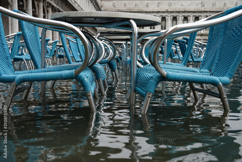 Chairs and tables in flooded Piazza San Marco Chairs and tables in flooded Piazza San Marco