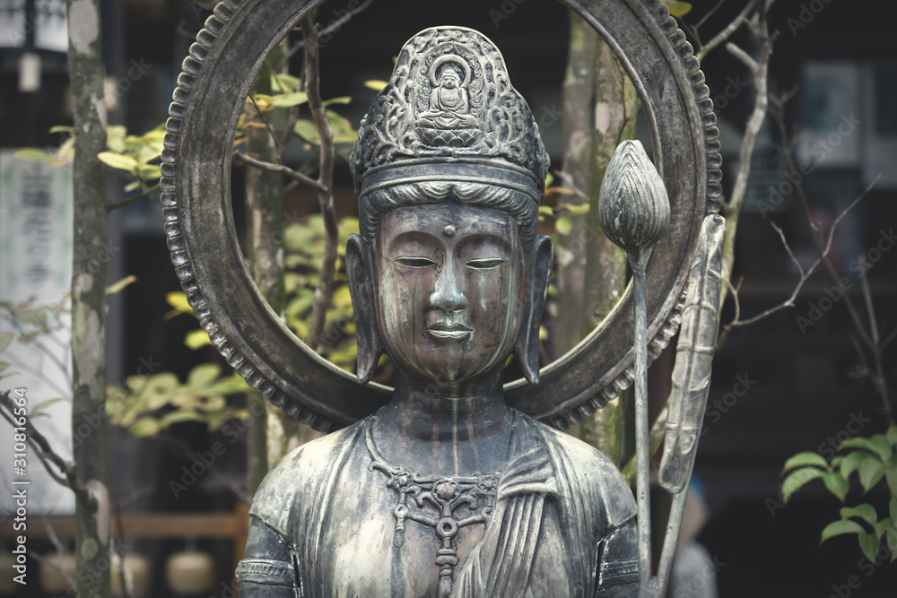 Fototapeta premium Close up of Buddha statue at Daishion temple at Miyashima, Japan
