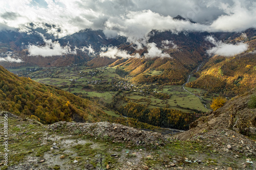 Mountain slopes covered with forests and low thunderclouds in Svaneti in the mountainous part of Georgia