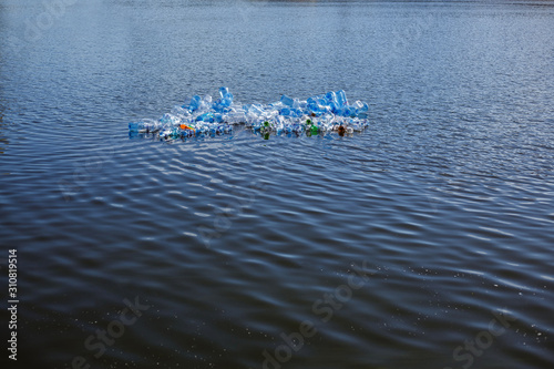 Floating glass. The problem of plastic pollution under the concept of the sea.