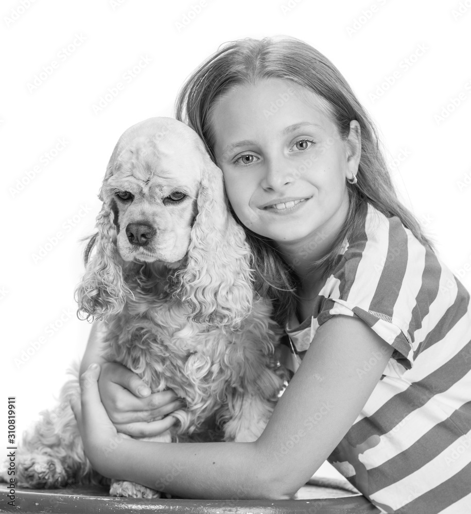 Pretty smiling girl with american spaniel posing in studio Pretty smiling girl with american spaniel posing in studio