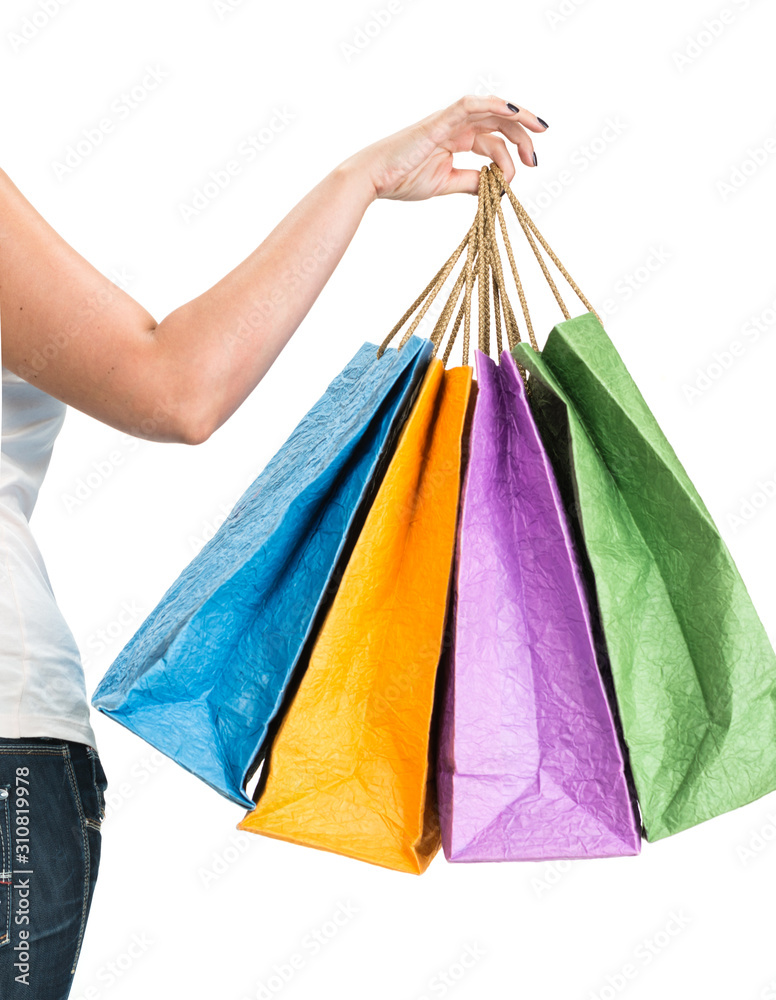 Woman posing with  shopping bags on a white background