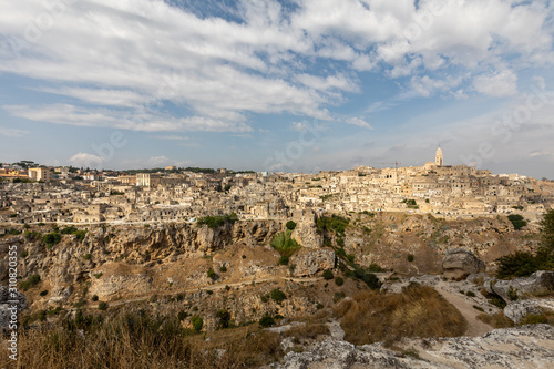 Panoramic view of Sassi di Matera a historic district in the city of Matera, well-known for their ancient cave dwellings from the Belvedere di Murgia Timone, Basilicata, Italy