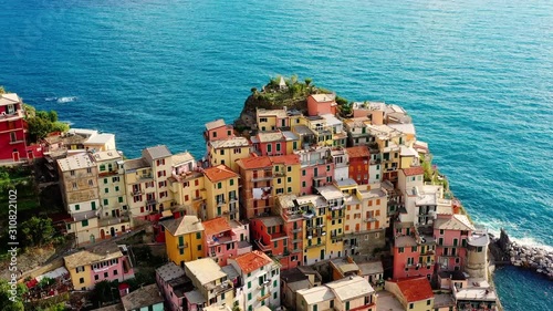 Village of Manarola in aerial view, Cinque Terre coast of Italy. Manarola is a small town in the province of La Spezia, in Liguria, in northern Italy and one of the Cinque Terre attractions for touris photo