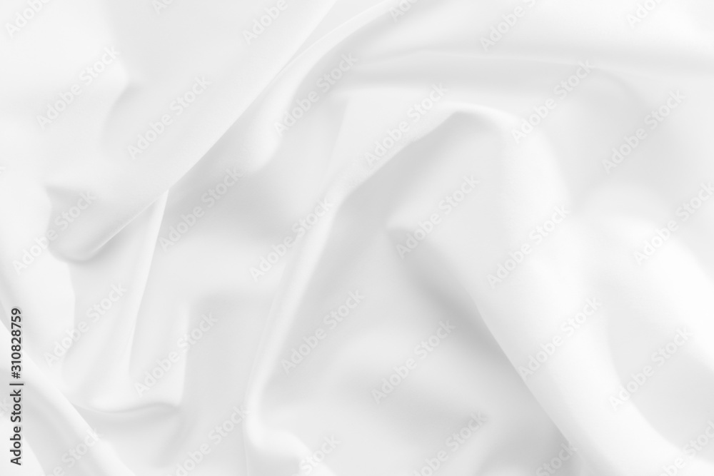 Fototapeta premium Abstract white fabric texture background. Cloth soft wave. Creases of satin, silk, and cotton.